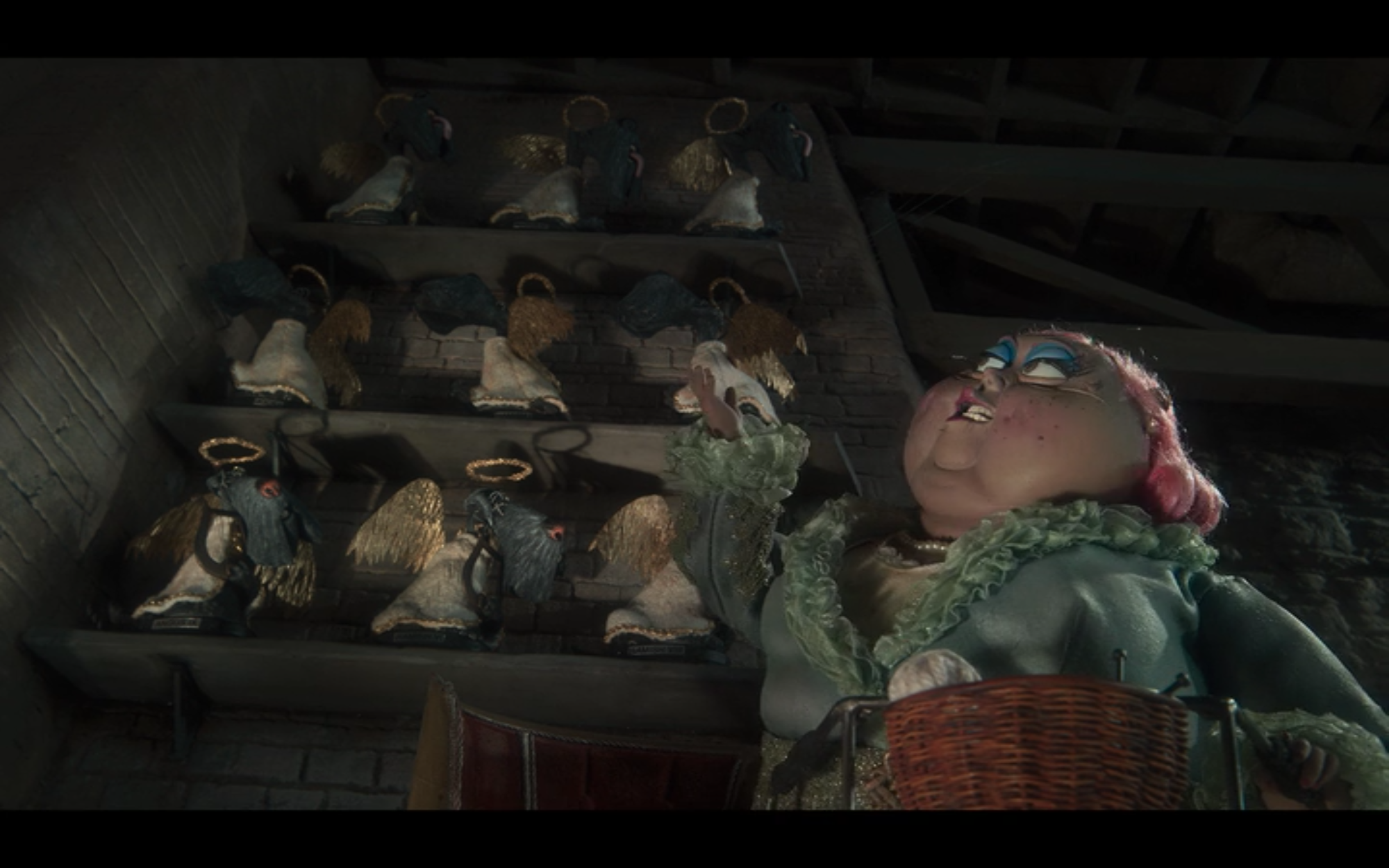 practice film vocabulary and analysis with coraline. low angle shot looking up at Miss Forcible.