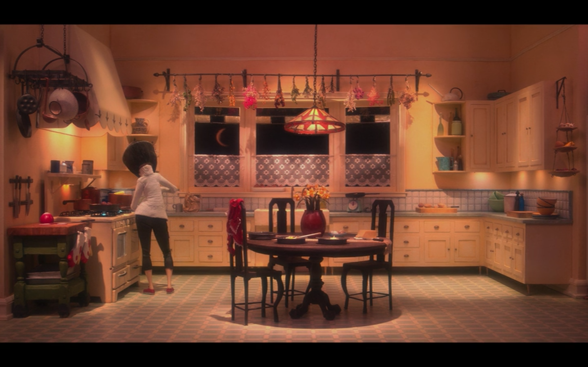practice film vocabulary and analysis with coraline. level shot of the other mother in the other world.
